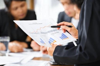 businessperson examining graph