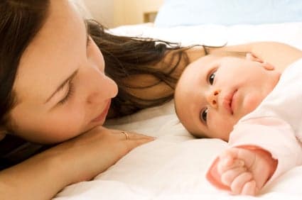 mother cuddling baby