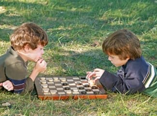 boys playing checkers