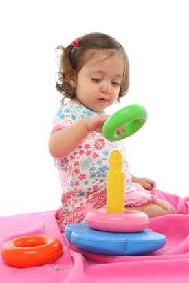 Toddler playing with generic toy