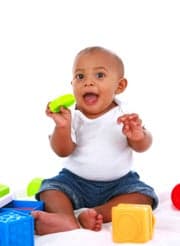 7-month old baby playing with toys
