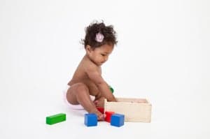 Infant with building blocks