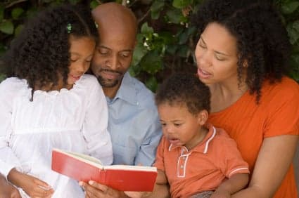 family reading book together