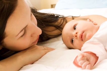 mother cuddling baby