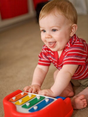 baby playing with toy