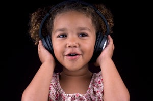 toddler with earphones