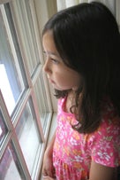 girl looking out of window
