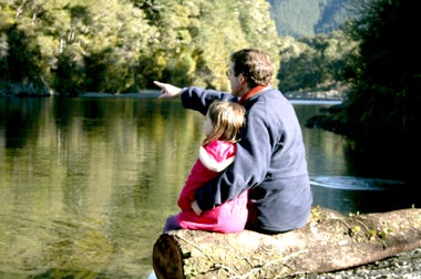 girl with father at lake