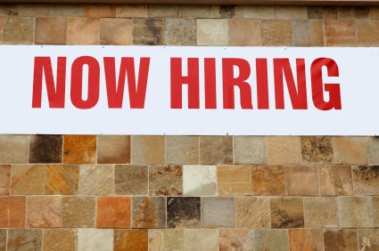 "now hiring" sign
