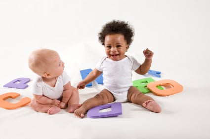 Infants playing with toys