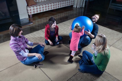 Adults and children playing